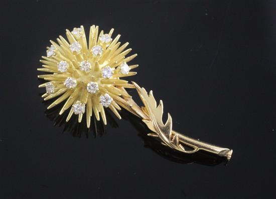 A French 18ct gold and diamond set brooch, modelled as a thistle, 51mm.